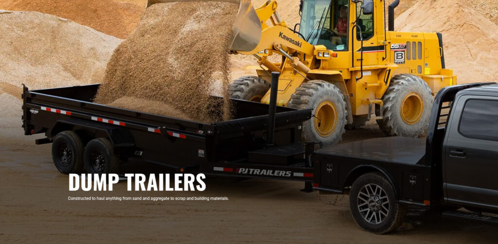 Loader dumping sand into dump trailer